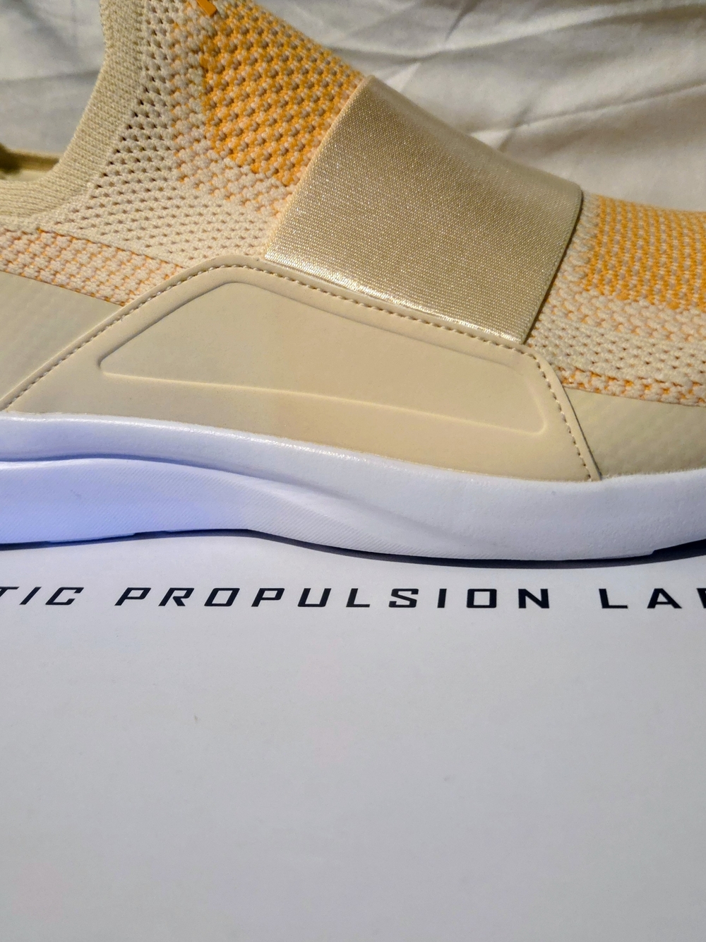 APL Techloom Bliss Knit Sneaker in Vanilla, Mango, And White